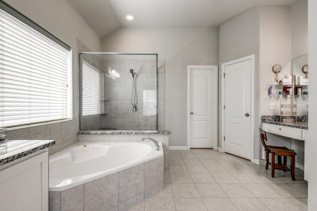 1316 Torrington Lane Forney, TX 75126 - Photo 21 of 36 a spacious bathroom with a tub sink and mirror