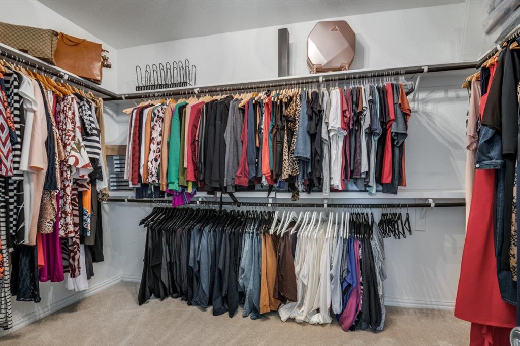 1316 Torrington Lane Forney, TX 75126 - Photo 22 of 36 a view of walk in closet with clothes