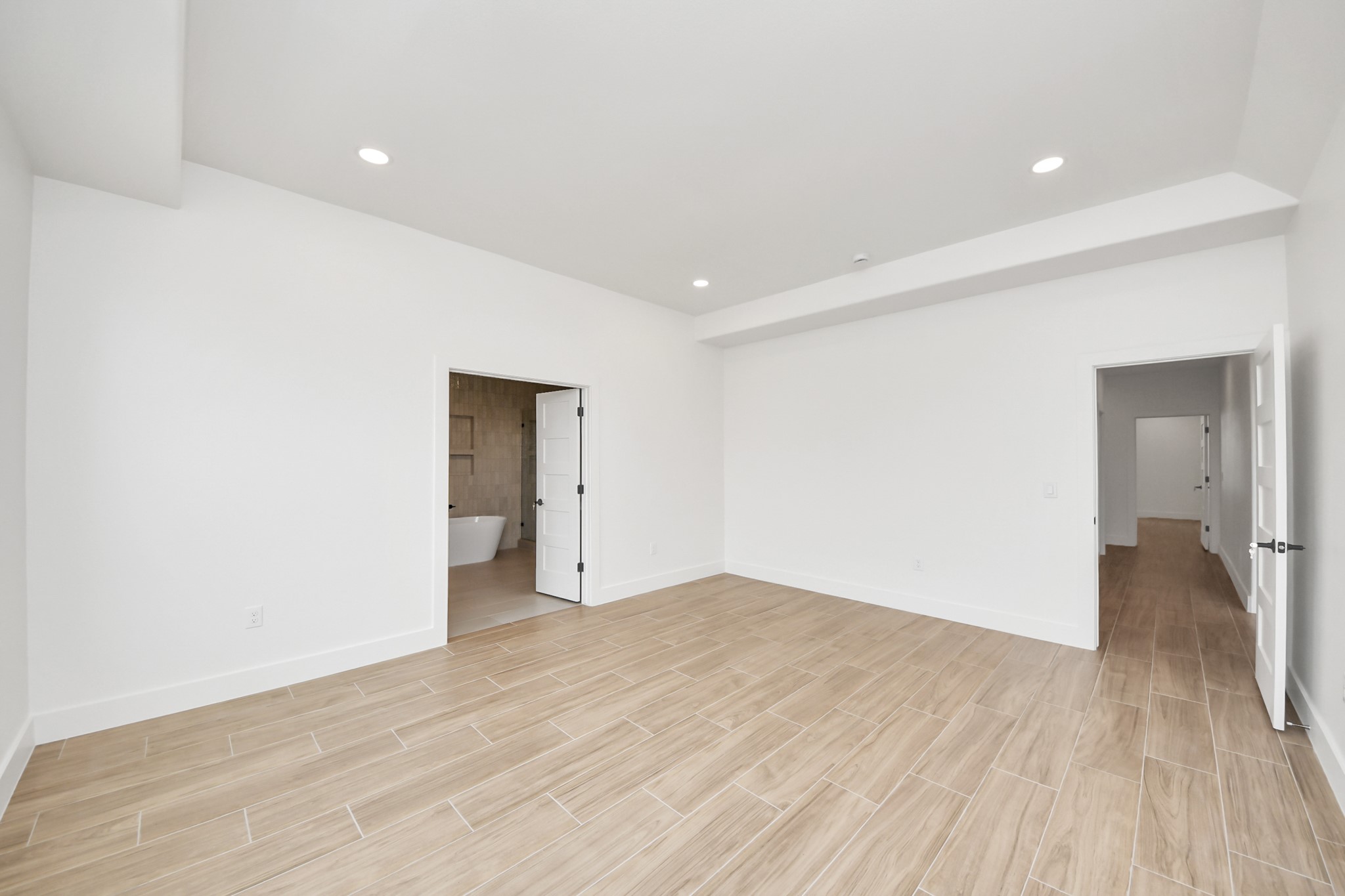 5811 County Road 675B Rosharon, TX 77583 - Photo 11 of 30 Wood like tile floors throughout the entire home. First Primary Bedroom