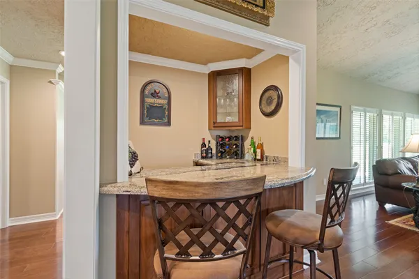 a view of a dining room with furniture and window