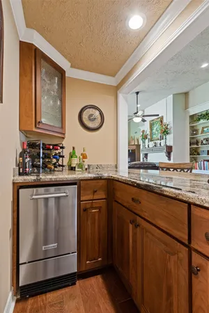 a kitchen with stainless steel appliances granite countertop a stove and cabinets