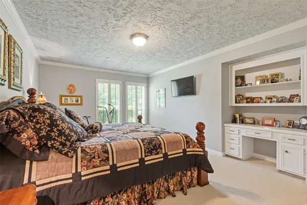 a bedroom with a bed and a cabinets