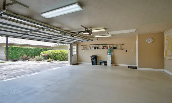 a view of a house with a yard and garage