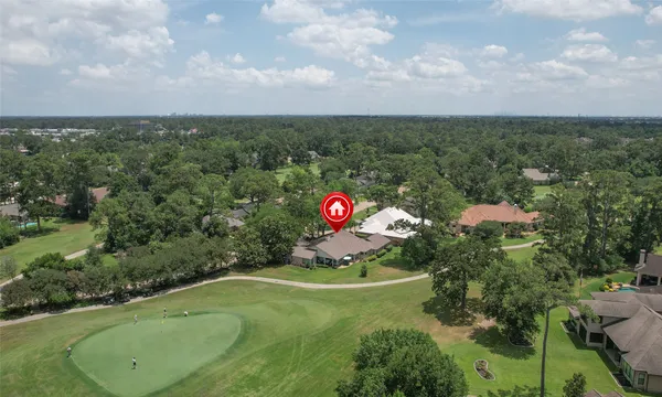a aerial view of a house with a yard