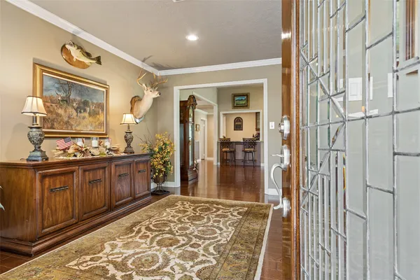 a spacious bathroom with a granite countertop sink a mirror and shower