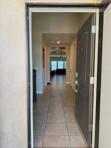 a view of a kitchen with a sink and cabinets