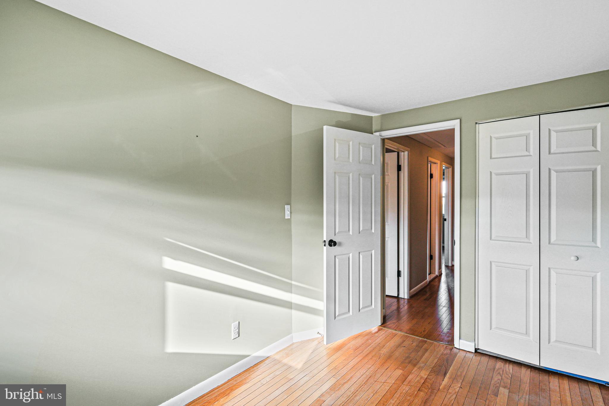 942 Grovehill Road Halethorpe, MD 21227 - Photo 24 of 30 a view of a hallway with wooden floor