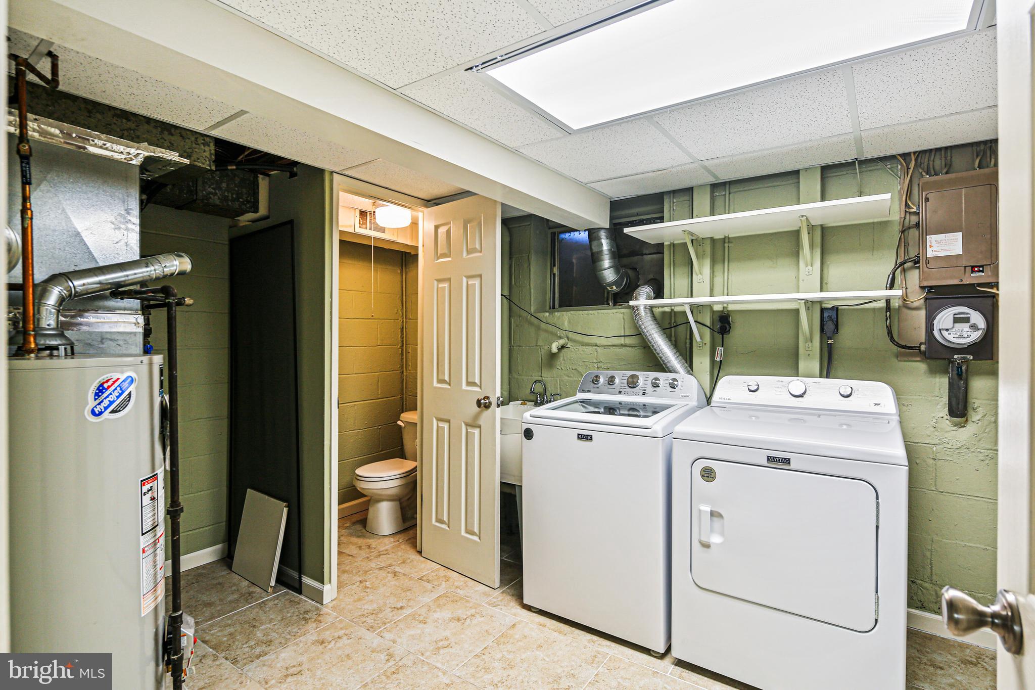 942 Grovehill Road Halethorpe, MD 21227 - Photo 25 of 30 a utility room with dryer and washer