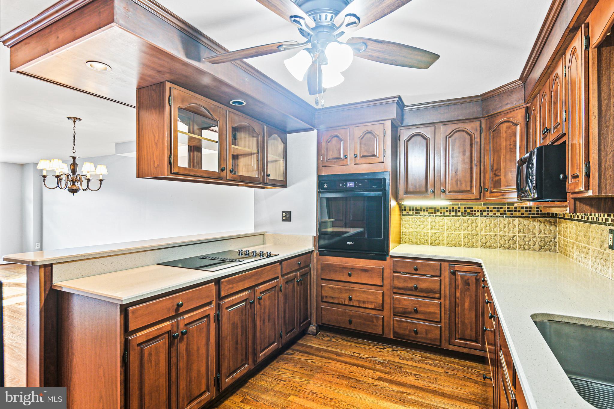 942 Grovehill Road Halethorpe, MD 21227 - Photo 3 of 30 a kitchen with stainless steel appliances granite countertop a stove and a sink