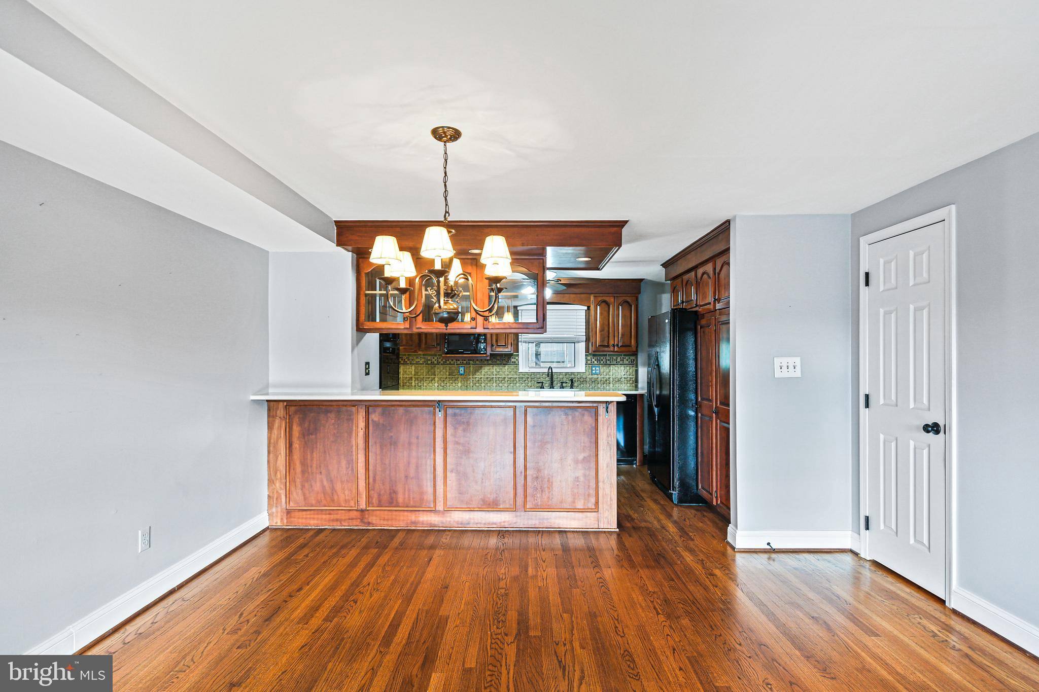 942 Grovehill Road Halethorpe, MD 21227 - Photo 6 of 30 a view of a room with wooden floor cabinets and entryway