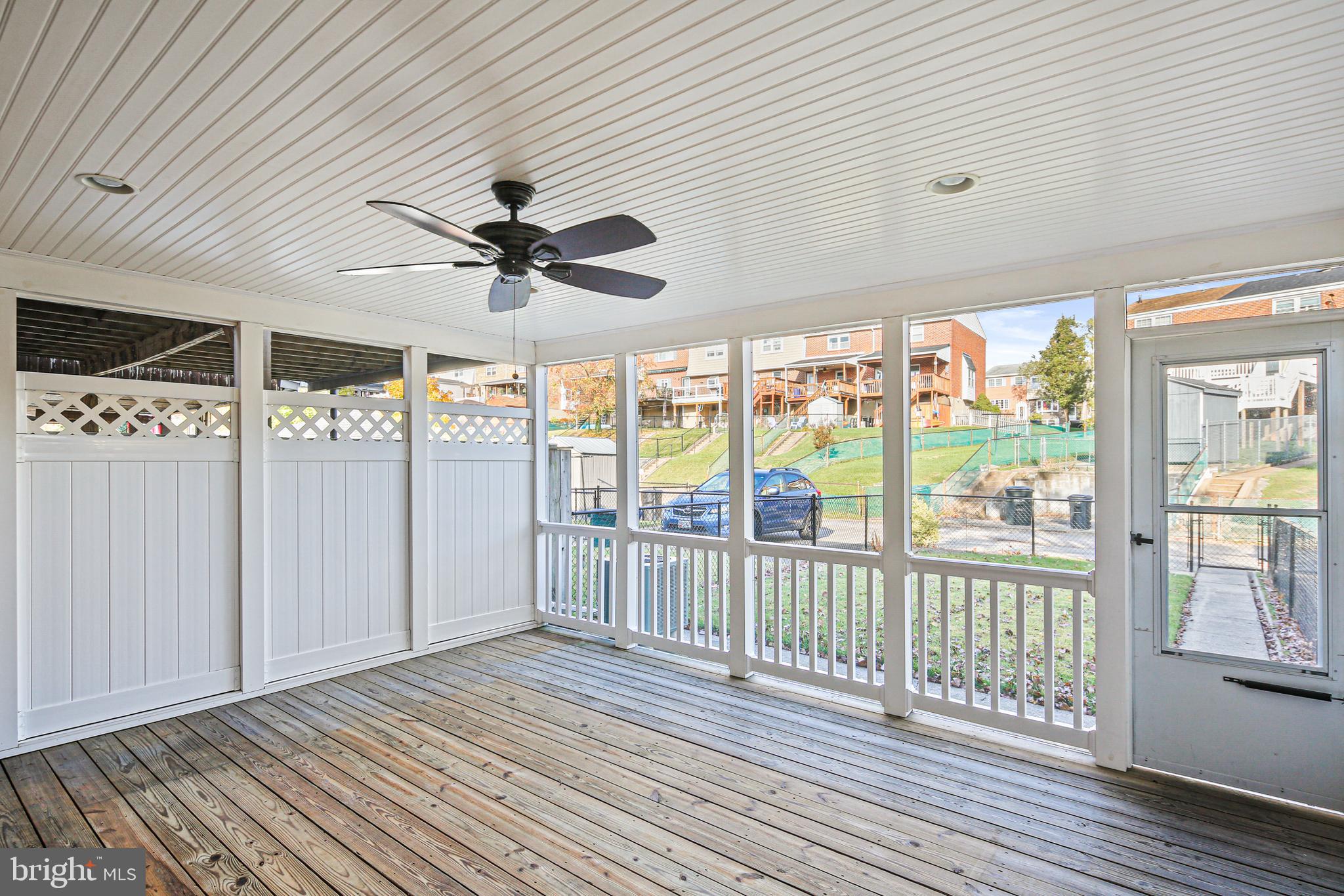 942 Grovehill Road Halethorpe, MD 21227 - Photo 10 of 30 a view of a livingroom with wooden floor and a ceiling fan