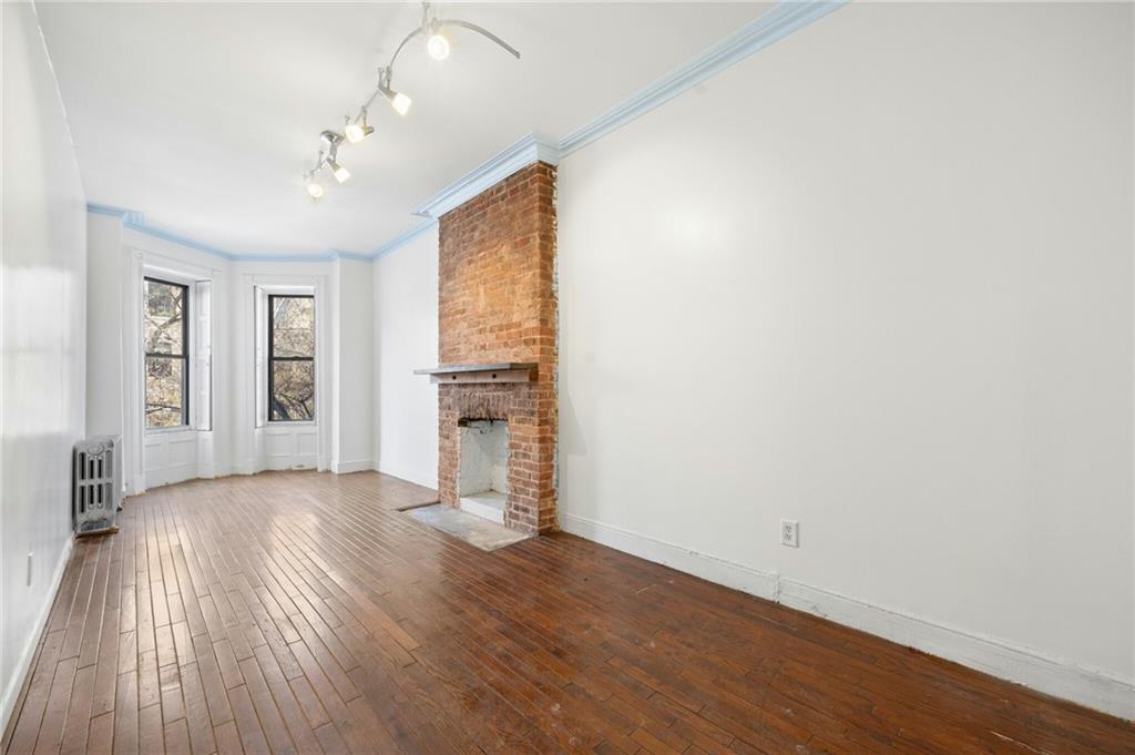 413 A 6th Avenue Brooklyn, NY 11215 - Photo 13 of 30 wooden floor in an empty room with a window