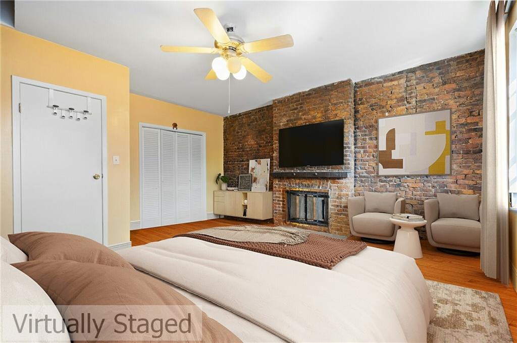 413 A 6th Avenue Brooklyn, NY 11215 - Photo 17 of 30 a living room with furniture and a flat screen tv