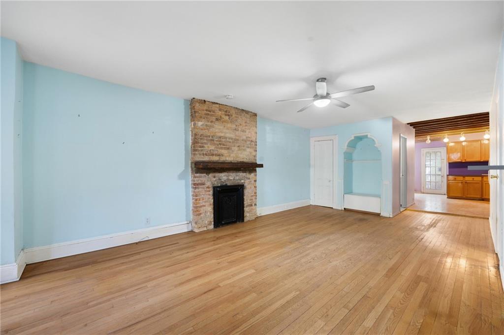 413 A 6th Avenue Brooklyn, NY 11215 - Photo 23 of 30 a view of empty room with wooden floor and fireplace