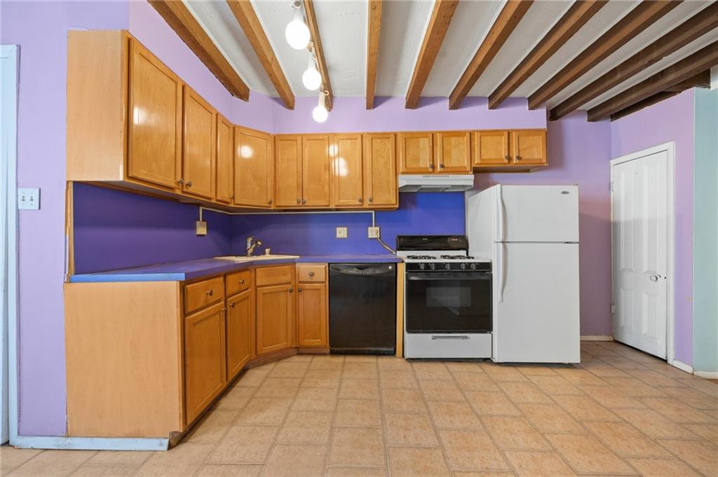 413 A 6th Avenue Brooklyn, NY 11215 - Photo 25 of 30 a kitchen with stainless steel appliances a refrigerator and a stove