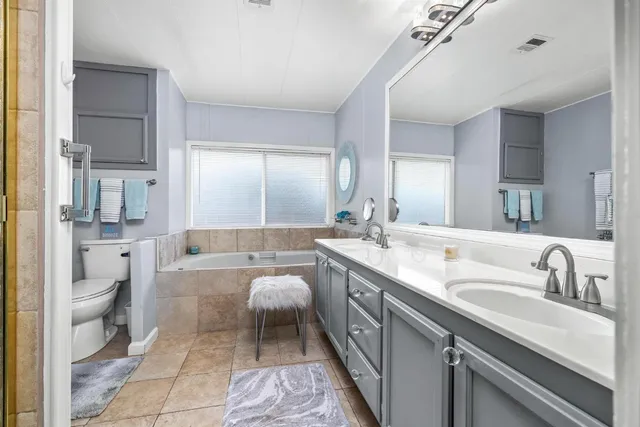 a bathroom with a bathtub and a sink