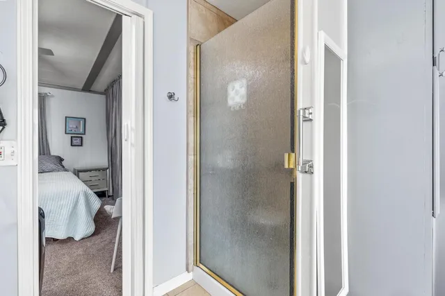 a bedroom with a bed and a dresser