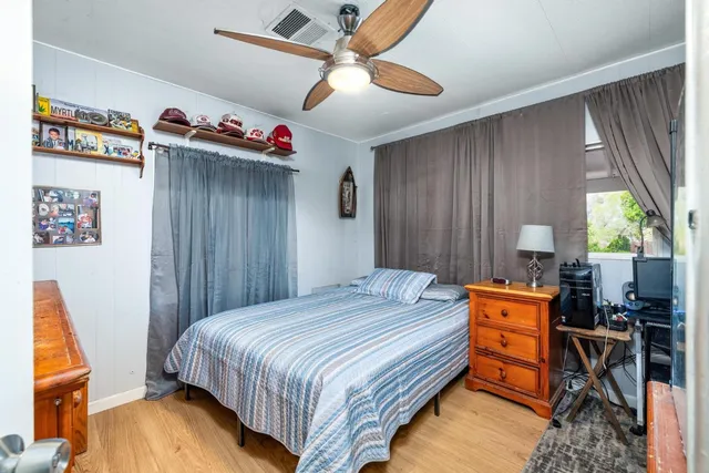 an aerial view of residential houses with outdoor space and lake view