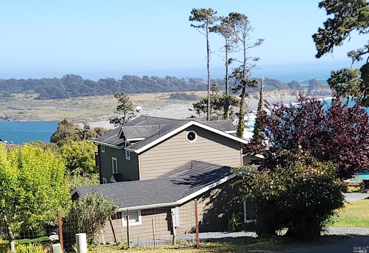 a view of a house with a ocean view