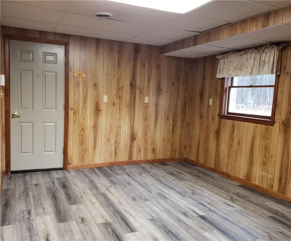 2525 Moore's Corner Road Volant, PA 16156 - Photo 27 of 40 a view of an empty room with wooden floor and a window