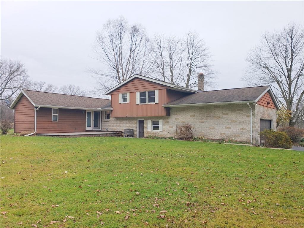 2525 Moore's Corner Road Volant, PA 16156 - Photo 29 of 40 a front view of a house with garden