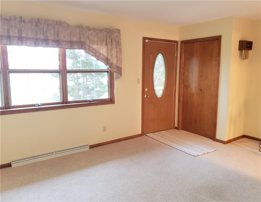 2525 Moore's Corner Road Volant, PA 16156 - Photo 3 of 40 an empty room with windows