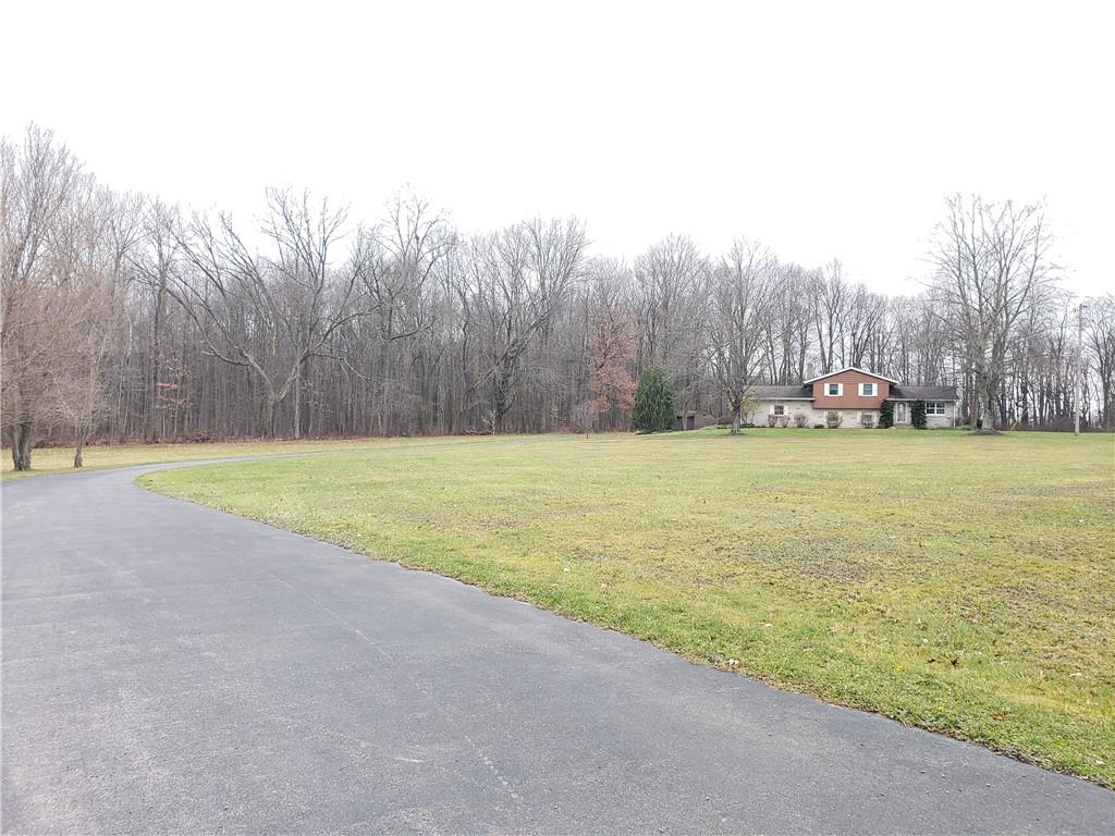 2525 Moore's Corner Road Volant, PA 16156 - Photo 40 of 40 a view of a swimming pool and trees in the background