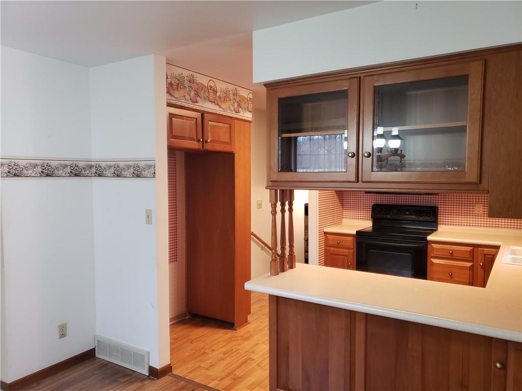 2525 Moore's Corner Road Volant, PA 16156 - Photo 8 of 40 a kitchen with stainless steel appliances granite countertop a refrigerator and a stove top oven