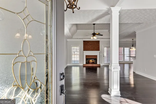 a view of living room with furniture and wooden floor