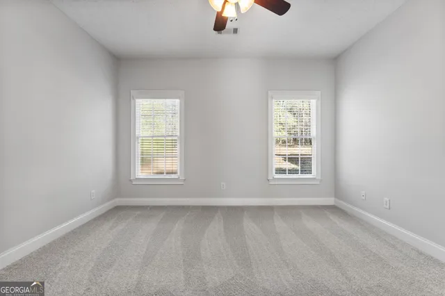 an empty room with windows