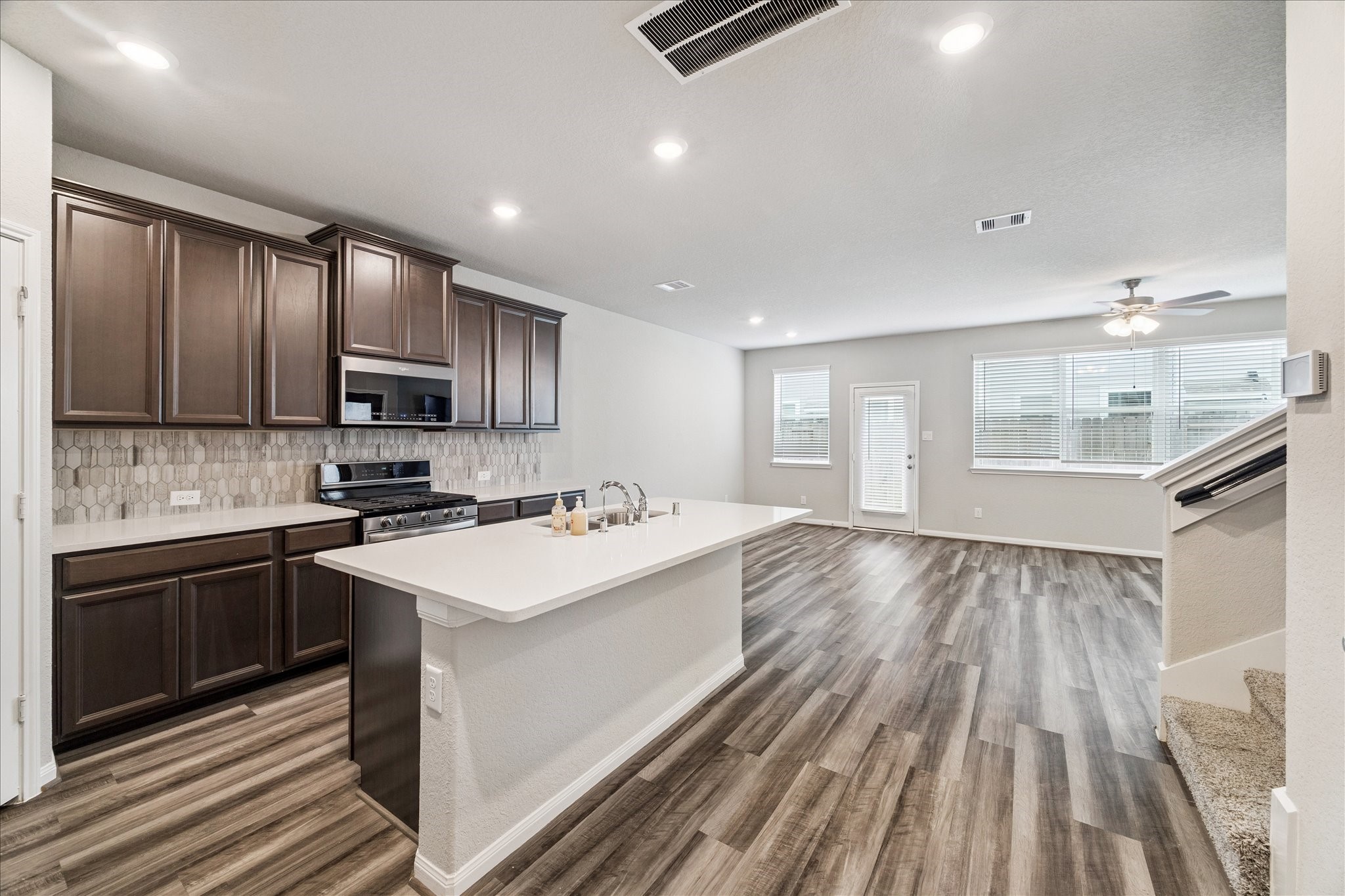 5502 Cuerta Street Houston, TX 77023 - Photo 8 of 25 Designer backsplash, plenty of cabinet space, and a gas range. The open concept means that you can spend quality time with friends and family alike while cooking in the kitchen.