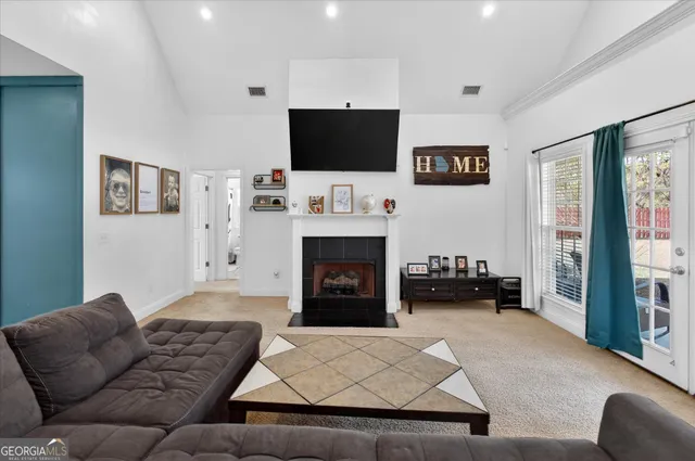 a living room with furniture and a fireplace