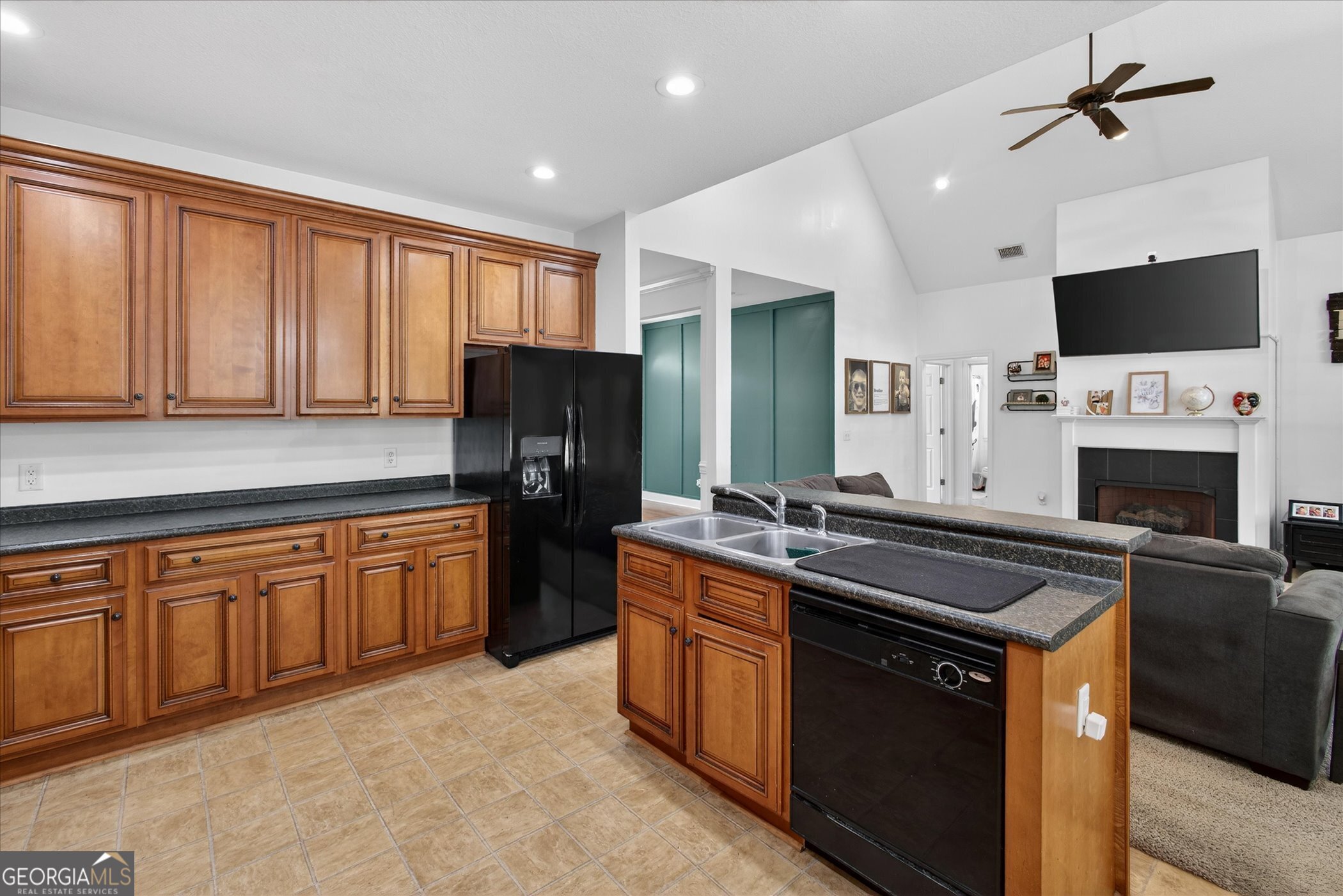 1600 Colony Lane Brooklet, GA 30415 - Photo 16 of 44 a kitchen with stainless steel appliances granite countertop a stove refrigerator sink and microwave