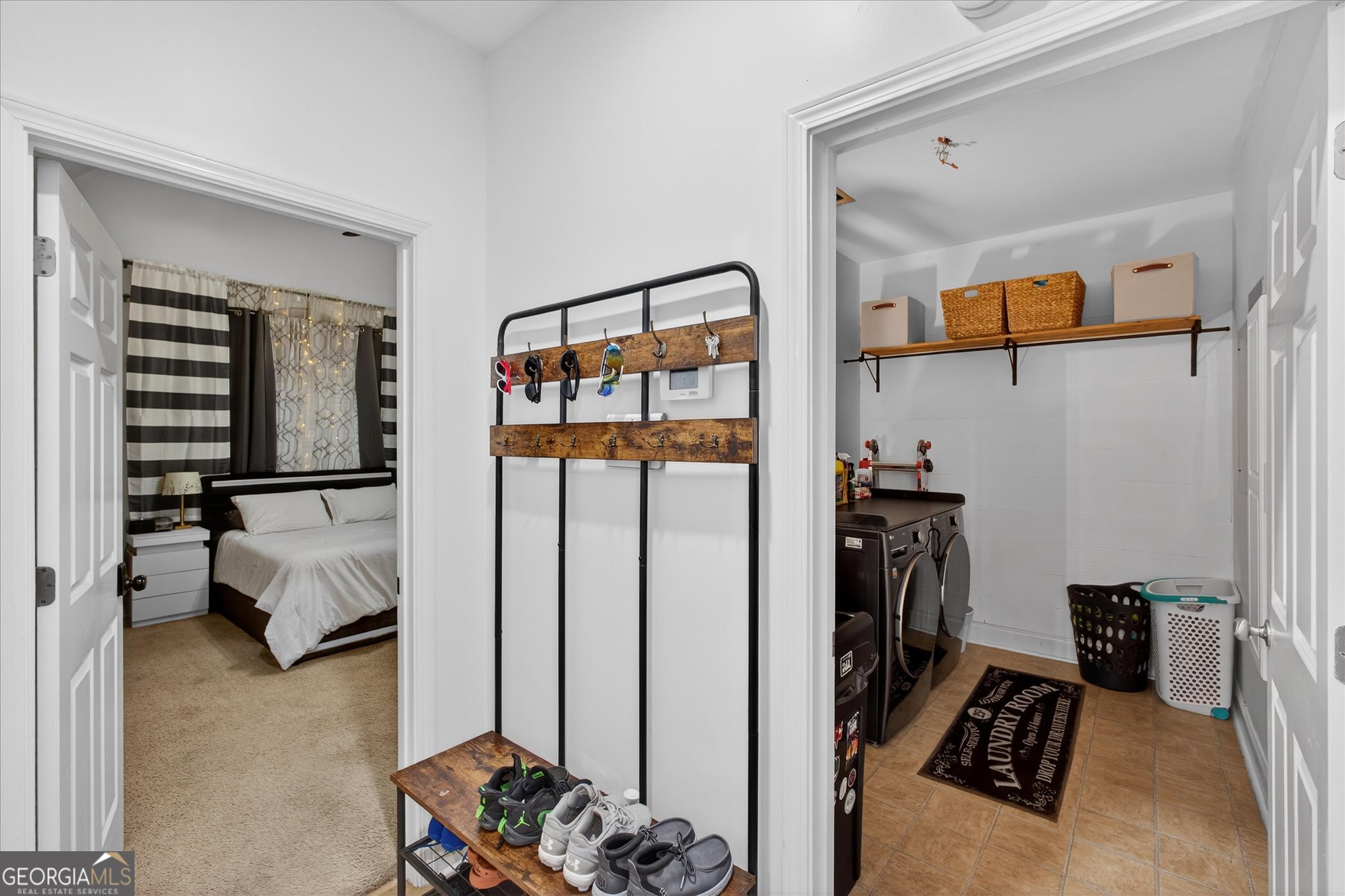 1600 Colony Lane Brooklet, GA 30415 - Photo 23 of 44 a view of gym equipment and living room with furniture and a flat screen tv