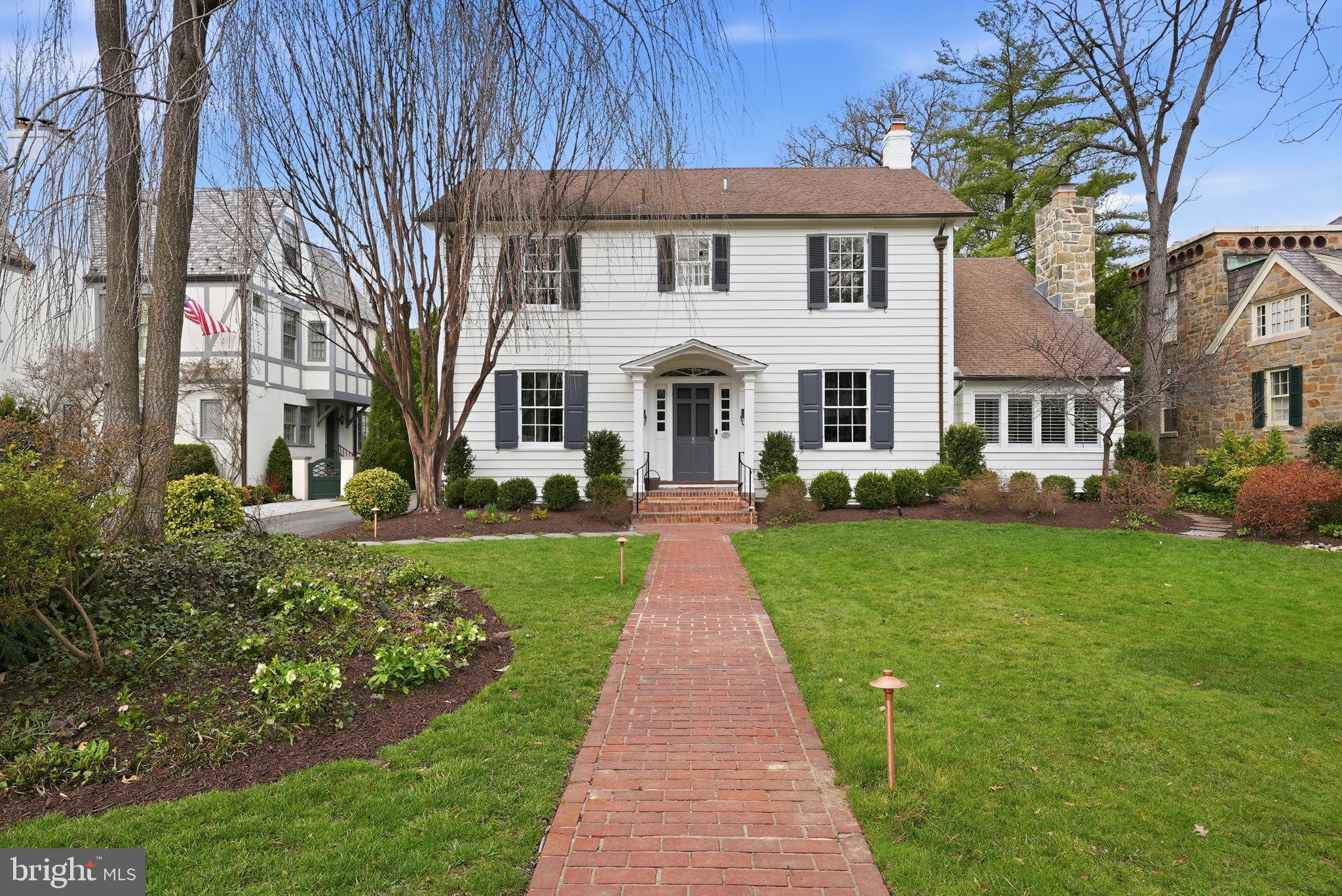 5 Primrose Street Chevy Chase, MD 20815 - Photo 1 of 1 a front view of a house with a yard