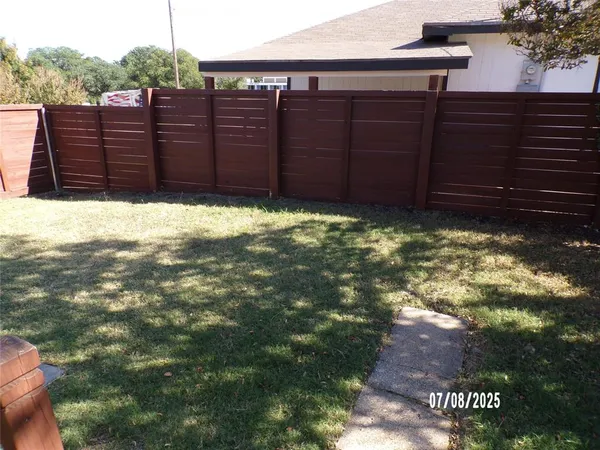 a view of a backyard of the house