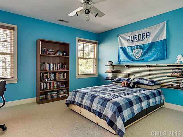 1440 Andover Road Charlotte, NC 28211 - Photo 12 of 16 a bedroom with a bed and a bookshelf