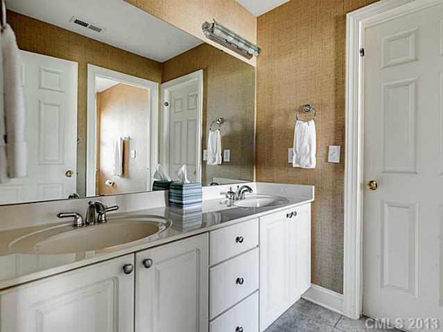 1440 Andover Road Charlotte, NC 28211 - Photo 13 of 16 a bathroom with a double vanity sink and a mirror