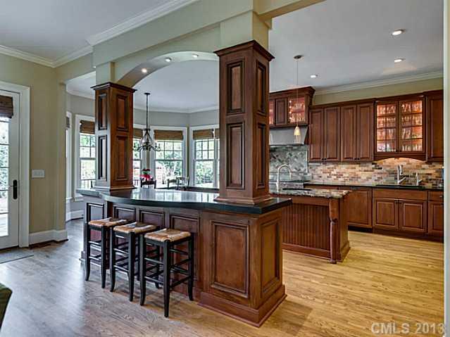 1440 Andover Road Charlotte, NC 28211 - Photo 4 of 16 a kitchen with granite countertop wooden cabinets and counter space