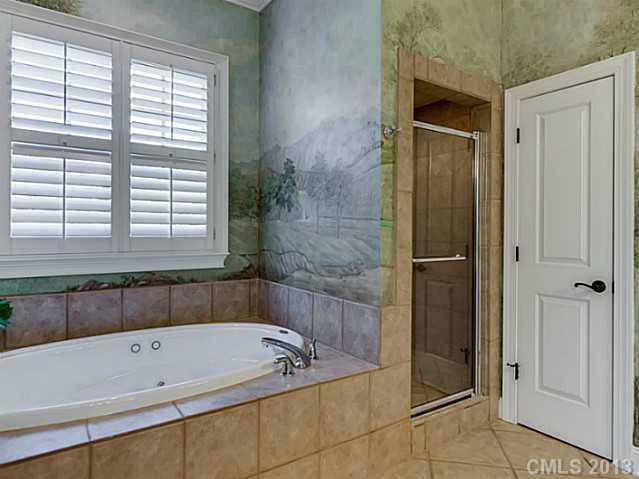 1440 Andover Road Charlotte, NC 28211 - Photo 10 of 16 a bathroom with a bathtub and a shower