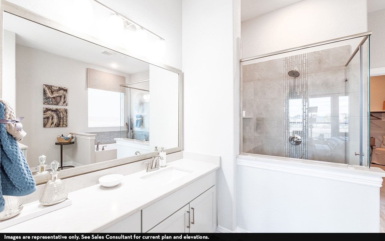 1051 Lakeland Circle Rosharon, TX 77583 - Photo 14 of 19 a bathroom with a tub sink and mirror