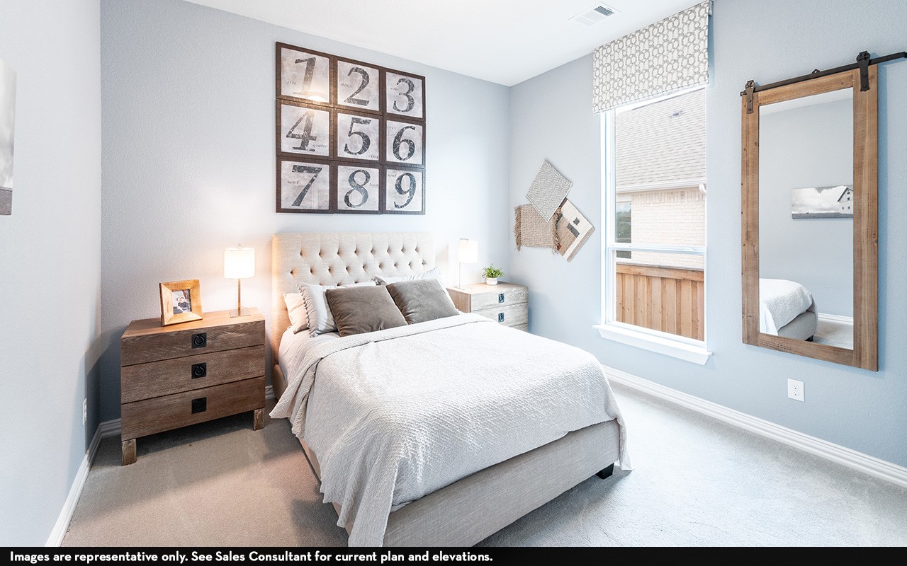 1051 Lakeland Circle Rosharon, TX 77583 - Photo 15 of 19 a bedroom with a bed and a painting on the wall