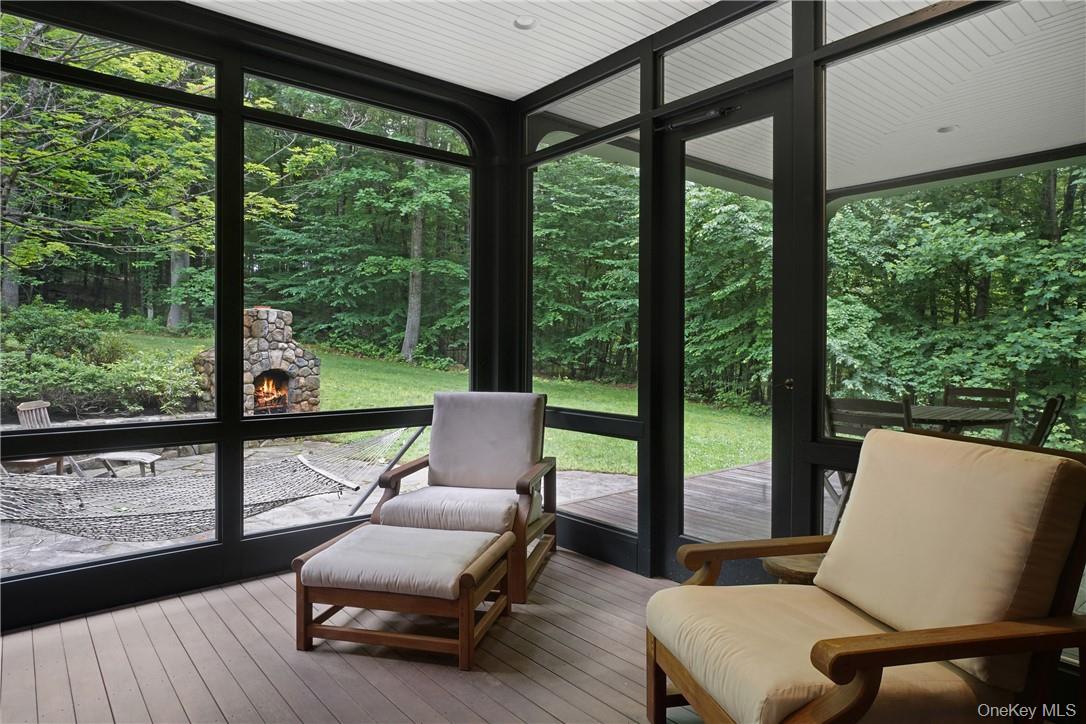 8 Brady Road Bedford Corners, NY 10549 - Photo 11 of 30 a living room with furniture and a floor to ceiling window