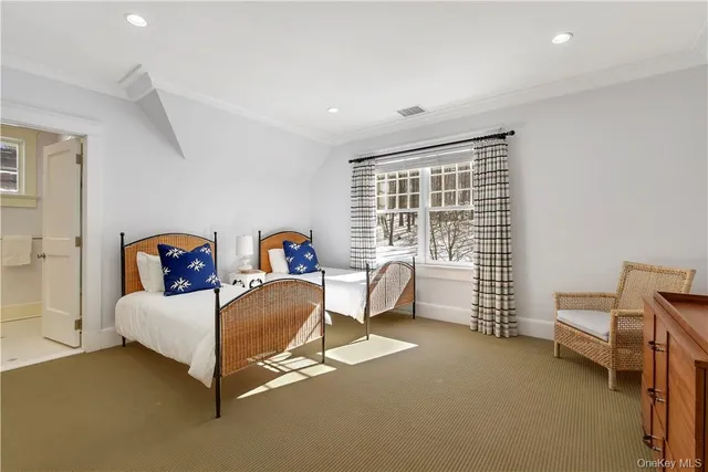 a bedroom with furniture and a window