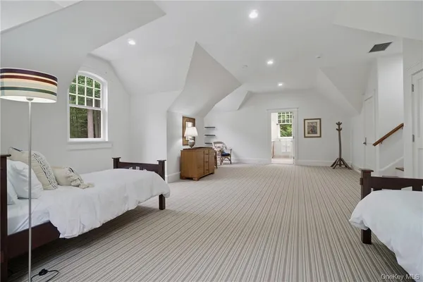 a bedroom with bed and window