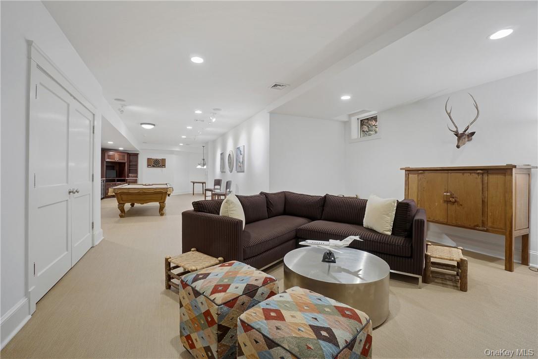 8 Brady Road Bedford Corners, NY 10549 - Photo 24 of 30 a living room with furniture and a mirror