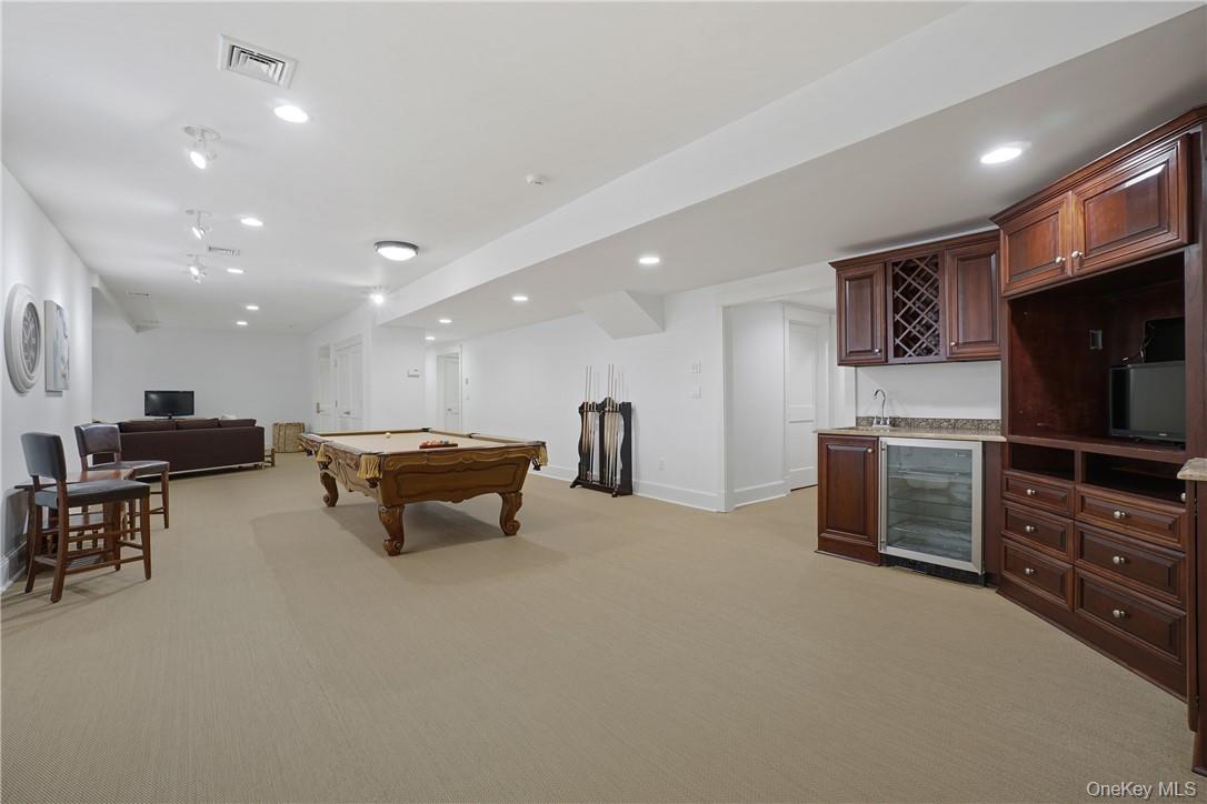 8 Brady Road Bedford Corners, NY 10549 - Photo 25 of 30 a living room with furniture and a flat screen tv