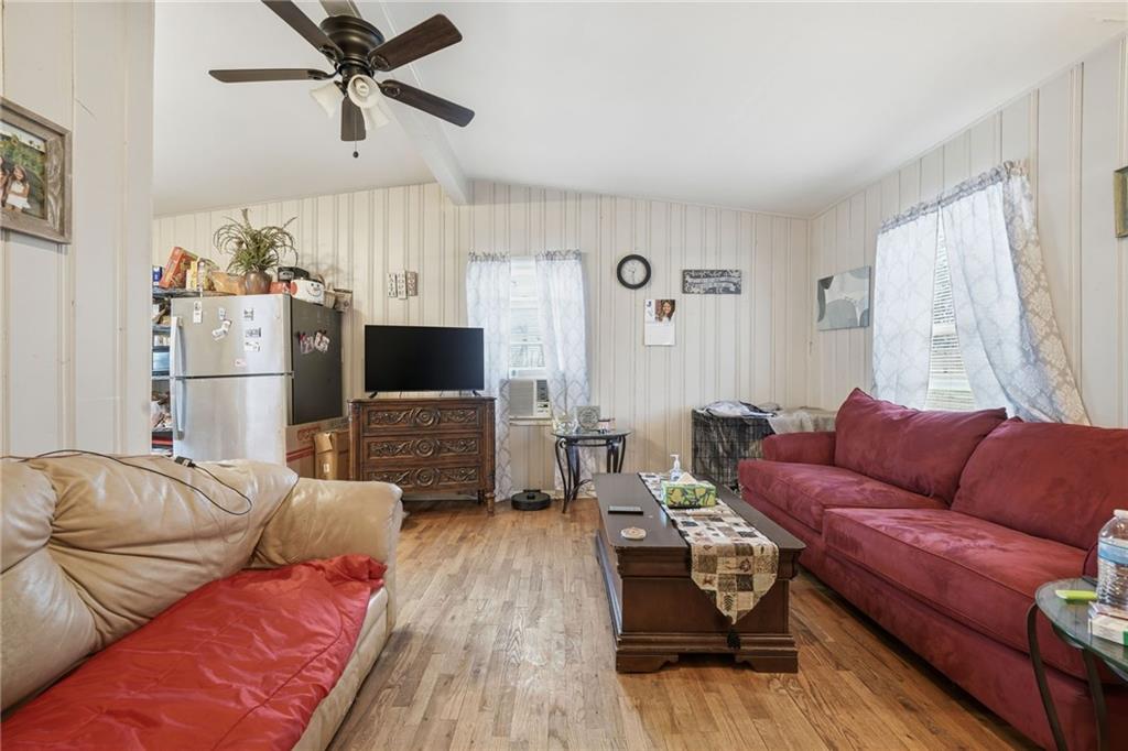 502 Old Canton Road Ball Ground, GA 30107 - Photo 16 of 29 a living room with furniture and a flat screen tv