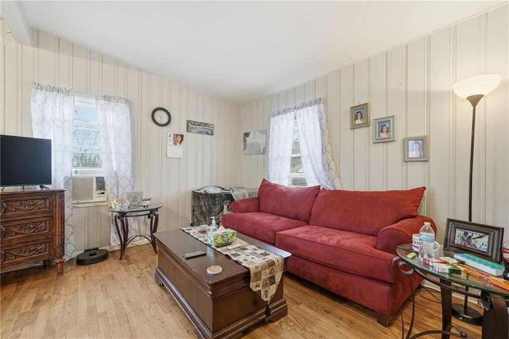 502 Old Canton Road Ball Ground, GA 30107 - Photo 17 of 29 a living room with furniture and a flat screen tv