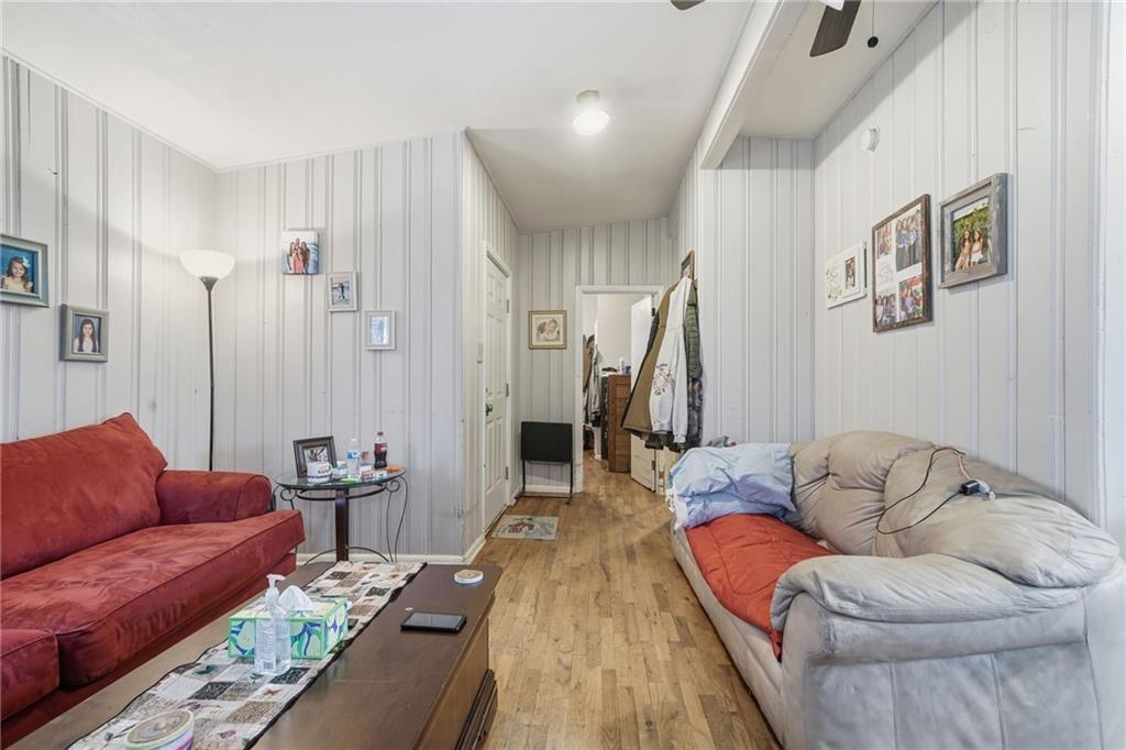 502 Old Canton Road Ball Ground, GA 30107 - Photo 19 of 29 a living room with furniture or couch and a wooden floor